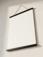 Black poster hanger with faux suede hanging strap